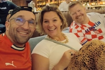 Photo of Crystal Johnson and Steve Manz from Keiser with Sandro Frietas watching the 2026 World Cup