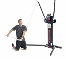 Man performing a Kneeling Cable Chop on a Keiser Functional Trainer