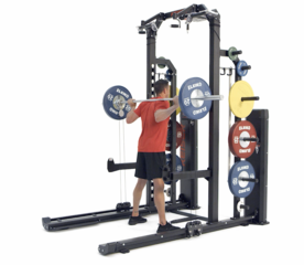 Man performing combined pneumatic and free weight back squats on a Keiser Rack