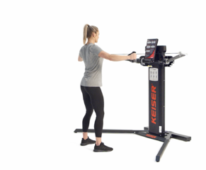 Woman performing a Standing Reverse Fly on a Keiser Functional Trainer