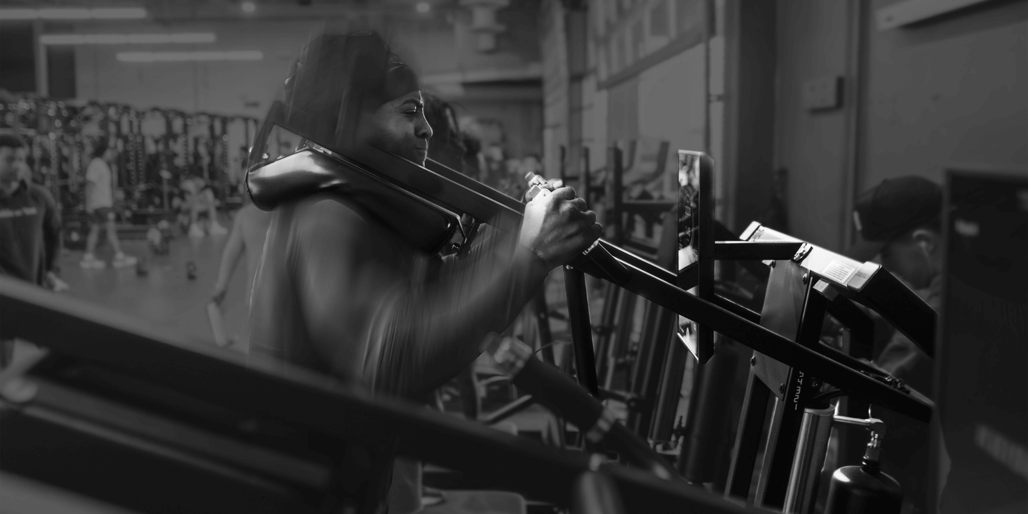 NFL Combine Athlete performing explosive squats on a Keiser A400 Squat machine at an Exos facility