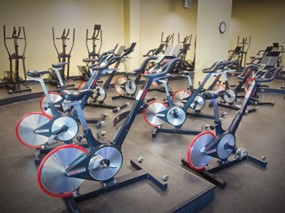 Cardio training room with Keiser M3i indoor group cycling bikes and Keiser M5i elliptical machines
