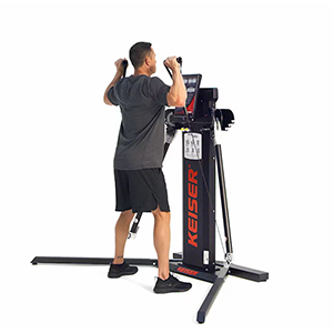 Man preparing to perform a front squat on a Keiser functional trainer
