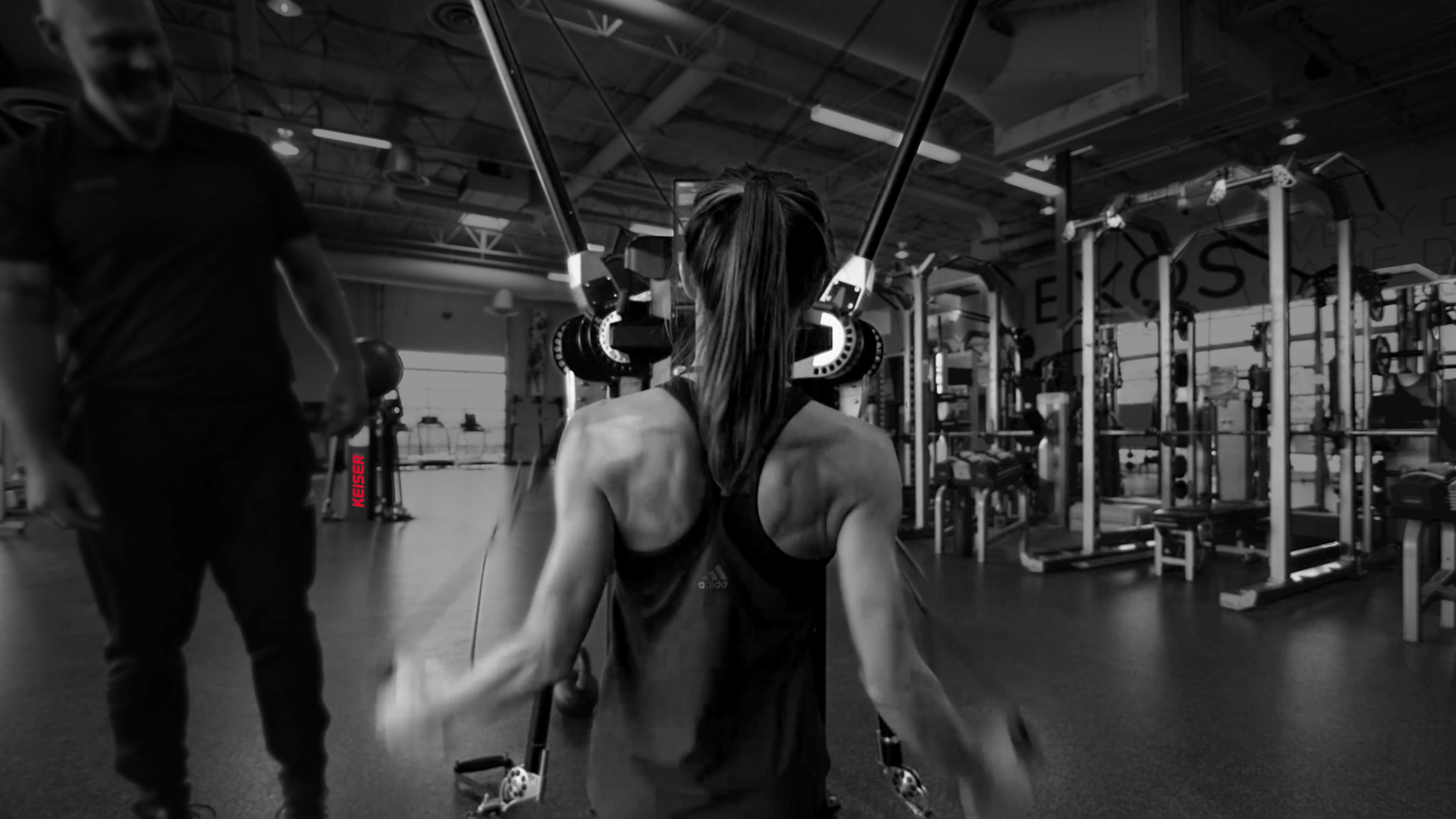 Woman on Keiser Cable Machine