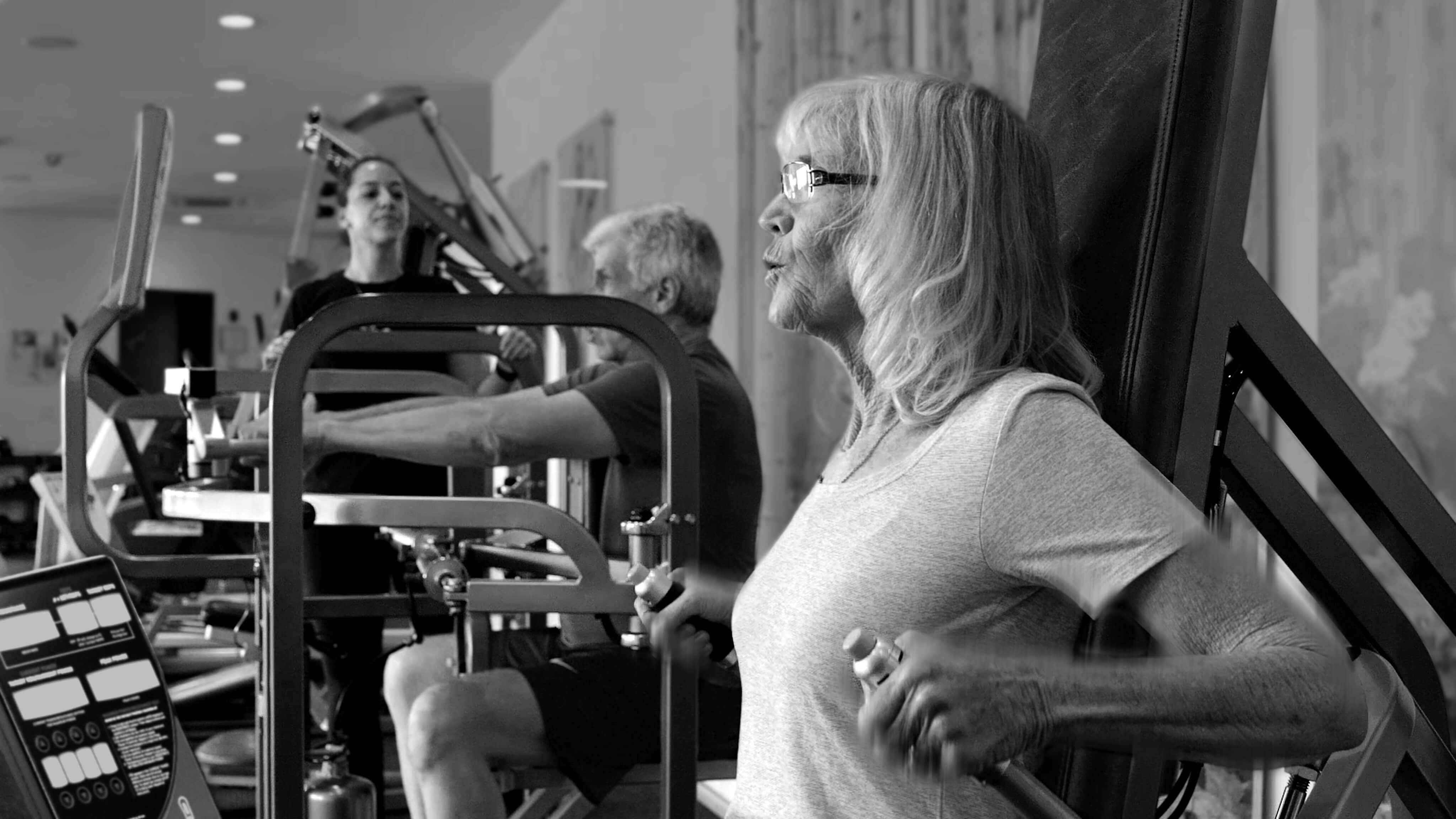 Woman training on Keiser Triceps machine