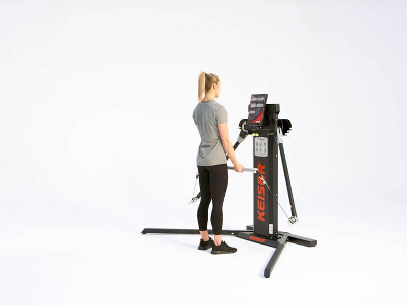 woman performing bicep curls at pulley machine