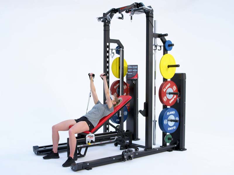 woman on Rack performing pneumatic resisted alternating incline bench press