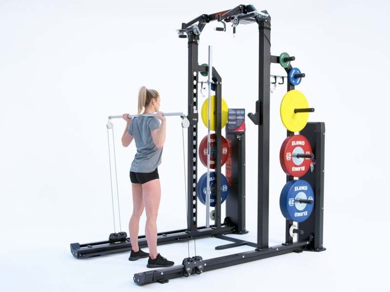 Woman at Rack performing pneumatic resisted Continuous Squat Jump with Bar