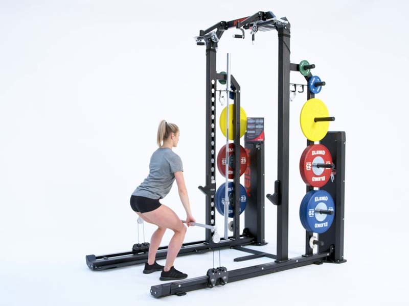 Woman at Rack performing pneumatic resisted High Pull