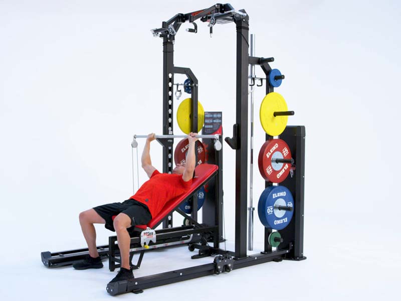 Man at Rack performing mixed mass resisted incline bench