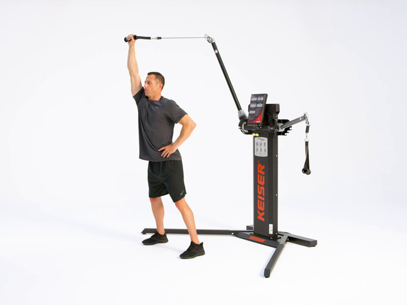 man conducting One Arm Overhead Tricep Extension at pulley machine