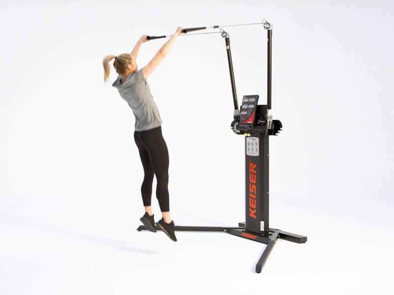 Woman on Functional Trainer conducting Cable Jump Slam
