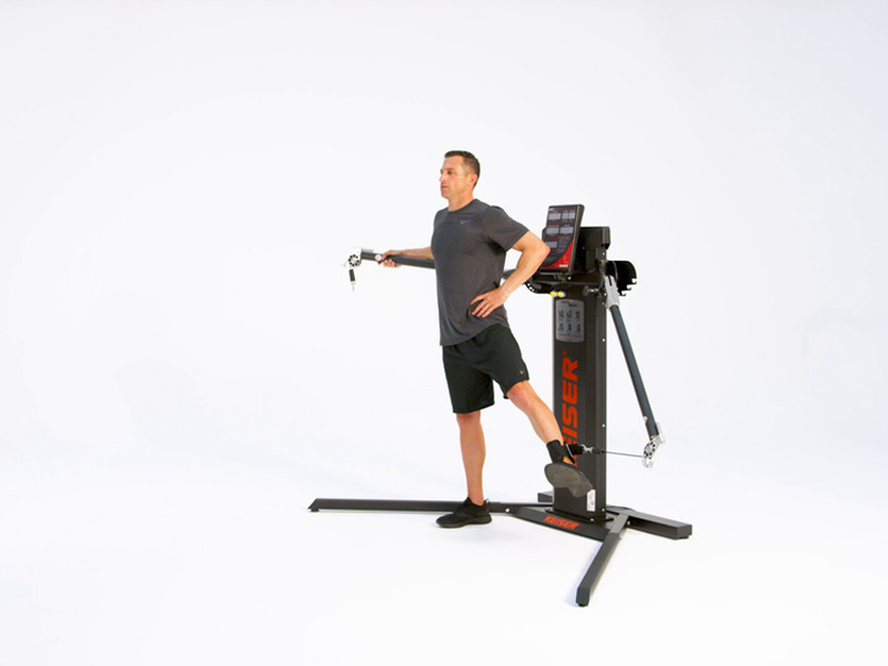 man on cable conducting Hip Adduction