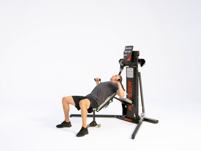 man on Keiser functional trainer conducting Incline Alternating Chest Press